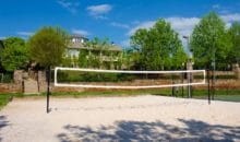 Full-size volleyball court at Woodlands of Charlottesville luxury apartments